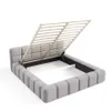 A grey upholstered bed frame with its slatted base lifted, revealing storage space underneath. Náhled obrázku produktu