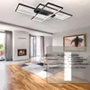 A modern living room with a geometric ceiling light and a fireplace. Náhľad obrázku produktu