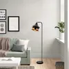 A modern living room with a sofa, coffee table, and a floor lamp. Produktbild-Vorschau