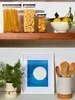 A shelf with kitchen storage containers and a framed picture. Produktbild-Vorschau