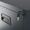 A close-up view of a gray filing cabinet with a key in the lock and a drawer handle. Náhled obrázku produktu