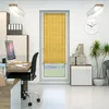An office setting with a desk, chair, computer, and a window with a bamboo blind. Produktbild-Vorschau