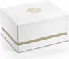 A white box with a gold logo on top, sitting on a white surface. Náhled obrázku produktu