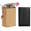 A bamboo recycling bin filled with bottles and cans, next to a black trash bag. Produktbild-Vorschau