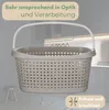 A laundry basket is shown in a room with a stool and some clothes on the floor. Produktbild-Vorschau