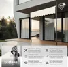 A modern building with a retractable awning installed on a balcony. Produktbild-Vorschau