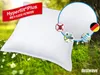 A white pillow or bag is shown in a grassy outdoor setting with flowers and a tree trunk. Produktbild-Vorschau