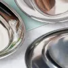 A close-up view of three oval stainless steel serving platters. Produktbild-Vorschau