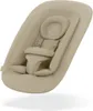 A baby bouncer seat with a harness, shown from a slightly elevated angle against a white background. Voir les images du produit
