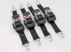 Four black ratchet straps with silver metal hooks and red release buttons are laid out diagonally on a white background. Anteprima dell’immagine prodotto