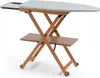 A wooden ironing board with a patterned cover and a shelf underneath, shown against a white background. Produktbild-Vorschau