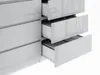 A close-up view of a white, high-gloss dresser with three drawers partially open, revealing storage compartments inside. Produktbild-Vorschau