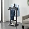 A men's valet stand with a shirt, pants, watch, and shoes displayed. Produktbild-Vorschau