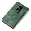 A green flip case for a smartphone is shown from a diagonal top-down view against a white background. Produktbild-Vorschau