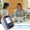 A doctor is taking a patient's blood pressure with a digital monitor. Produktbild-Vorschau