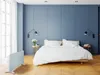 A modern bedroom with a bed, nightstands, and a heater. Produktbild-Vorschau