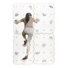 A young person is climbing on a white climbing wall with gray holds. Anteprima dell’immagine prodotto