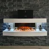 A modern electric fireplace with a white surround, set against a dark stone wall. Produktbild-Vorschau