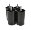 Four black plastic furniture feet with metal threaded bolts are arranged on a white background. Voir les images du produit