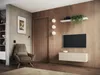 A modern living room with a TV mounted on a wooden wall, a lowboard, a chair, and a door. Produktbild-Vorschau
