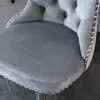 Close-up of a gray velvet bar stool with decorative studs along the edge. Produktbild-Vorschau