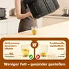 A person is pouring oil from an air fryer into a glass, with a comparison of fat reduction shown below. Produktbild-Vorschau
