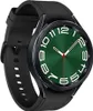 A close-up studio shot of a black smartwatch with a green watch face. Náhled obrázku produktu