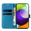 A blue flip cover phone case with a floral and butterfly design is shown open, revealing card slots and a banknote. A smartphone is displayed within the case. Produktbild-Vorschau