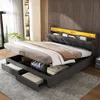 A modern bedroom with a bed featuring storage and LED lighting. Produktbild-Vorschau