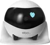 A white robot with a black face and a blue heart graphic on its face, sitting on a white charging base. Náhled obrázku produktu