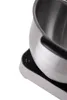 A close-up shot of a silver kitchen appliance, likely a stand mixer, on a white background. The appliance has a black control panel with two indicator lights and a symbol. A portion of the stainless steel bowl is visible. Anteprima dell’immagine prodotto