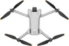A top-down view of a white and gray drone with black propellers. Náhľad obrázku produktu