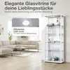 A living room scene featuring a white glass display cabinet filled with glassware and decorative items, next to a sectional sofa. Produktbild-Vorschau