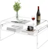 A transparent acrylic coffee table with books, a camera, a bottle of wine, and a glass of wine on it. Anteprima dell’immagine prodotto