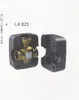 A brass valve is shown inside a black protective casing, which is split into two halves. Produktbild-Vorschau
