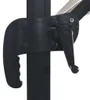 A close-up view of a black crank mechanism and part of an umbrella pole. Produktbild-Vorschau
