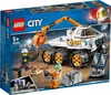 The image shows the packaging of a LEGO City Rover-Testfahrt set, featuring the toy rover and minifigures in a space-themed setting. Náhled obrázku produktu
