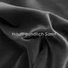 A close-up of dark gray velvet fabric with text overlay. Podgląd zdjęcia produktu