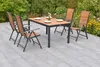 An outdoor patio setting with a dining set. Produktbild-Vorschau