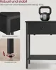 A close-up view of a black nightstand with a kettlebell on top, highlighting its features and durability. Produktbild-Vorschau