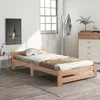 A bedroom scene with a wooden bed frame, a dresser, and a coat rack. Náhled obrázku produktu