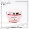A pink Kérastase Genesis hair mask jar is displayed on a white surface against a white background. Náhled obrázku produktu