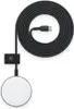 A white circular wireless charging pad with a black braided USB-C cable and a black clip attached to the cable. Produktbild-Vorschau