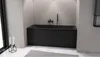 A modern black bathtub in a minimalist bathroom setting. Anteprima dell’immagine prodotto