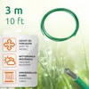 A green cable coiled on a background of grass with water droplets. Voir les images du produit