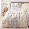 A close-up view of bedding with a rustic, nature-inspired design. Produktbild-Vorschau