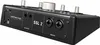 The back panel of a black audio interface is shown at an angle against a light gray background. Podgląd zdjęcia produktu