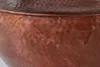 A close-up view of the textured surface of a copper table. Produktbild-Vorschau