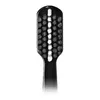 A close-up view of the head of a black toothbrush with white bristles. Anteprima dell’immagine prodotto