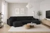 A modern living room with a large black sectional sofa. Podgląd zdjęcia produktu